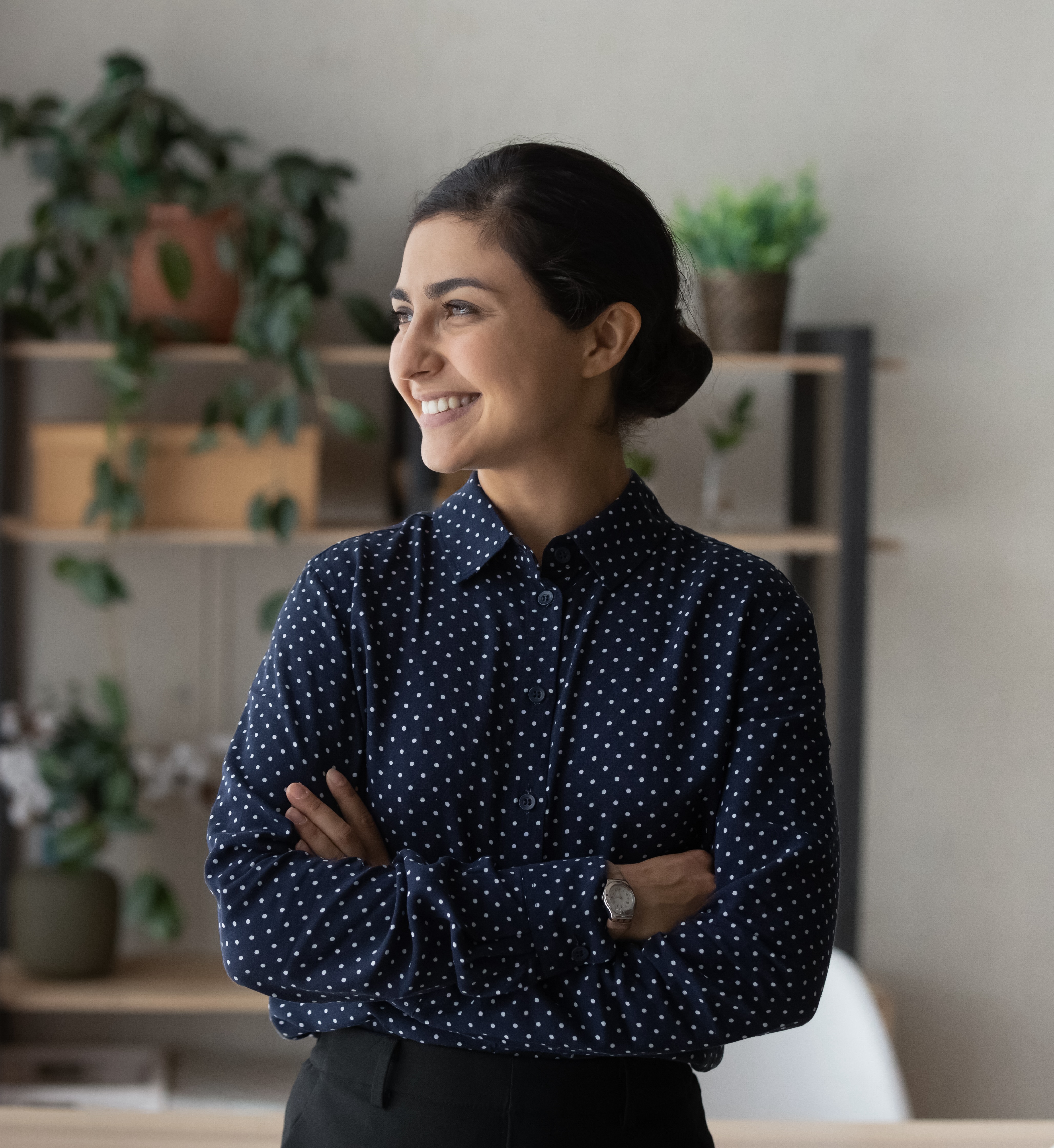 Profile smiling dreamy Indian businesswoman looking in distance Profile smiling dreamy Indian businesswoman looking in distance